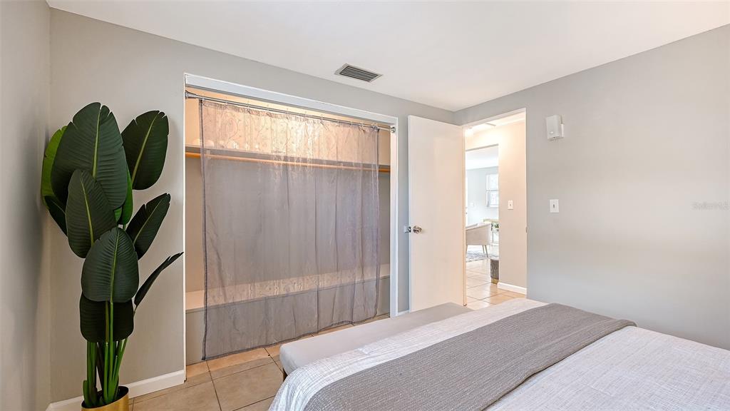 1860 7th Street Sarasota, FL 34236 - Photo 17 of 75 a bedroom with a bed and a mirror