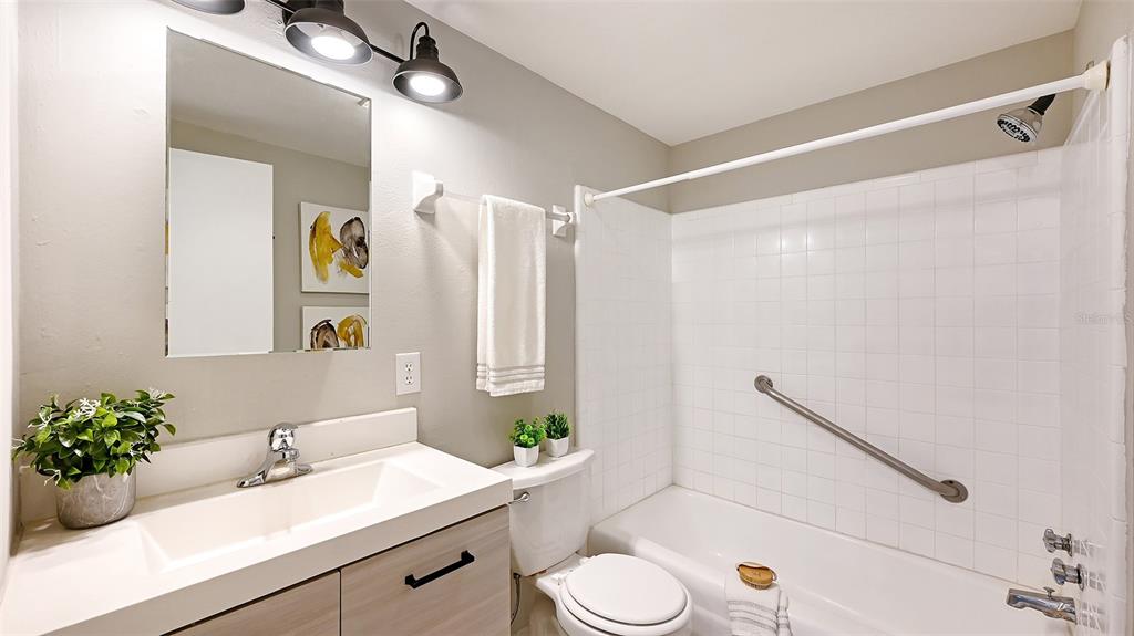 1860 7th Street Sarasota, FL 34236 - Photo 18 of 75 a bathroom with a sink mirror vanity and toilet