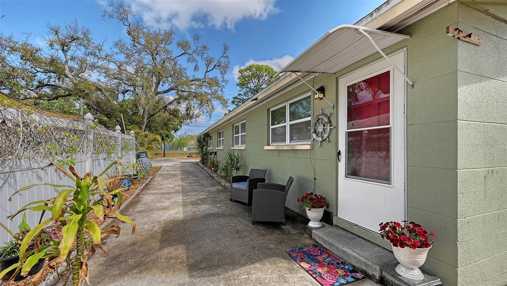 1860 7th Street Sarasota, FL 34236 - Photo 2 of 75 a backyard of a house with outdoor seating