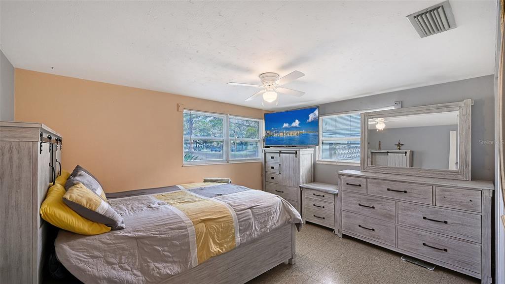 1860 7th Street Sarasota, FL 34236 - Photo 27 of 75 a bedroom with a bed and a mirror on the dresser