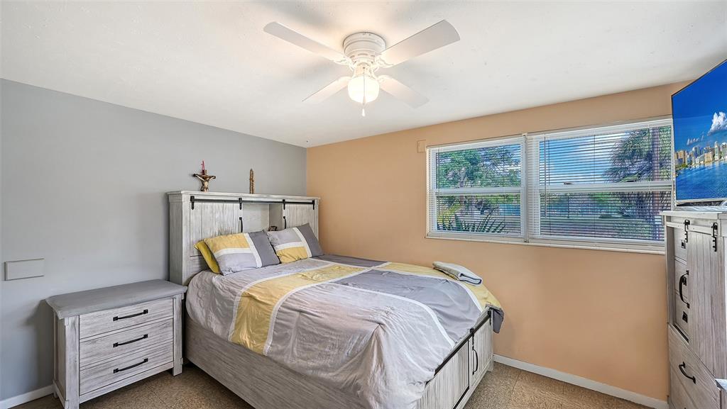 1860 7th Street Sarasota, FL 34236 - Photo 29 of 75 a bedroom with a bed dresser and a window