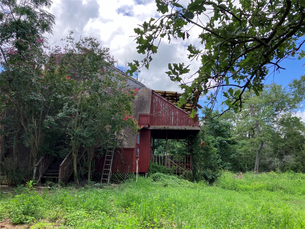 693 St Mary's Road Rosanky, TX 78953 - Photo 7 of 20 A-Frame House in need of repair or removal. Property is secluded with mature native trees.