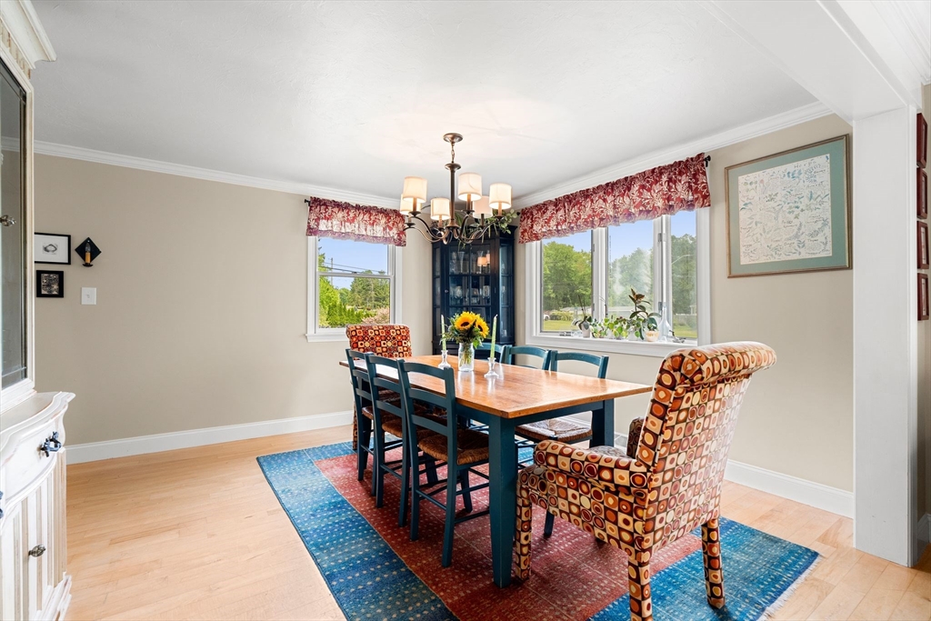 35 Spallus Road Stoughton, MA 02072 - Photo 15 of 39 a view of a dining room with furniture wooden floor and chandelier