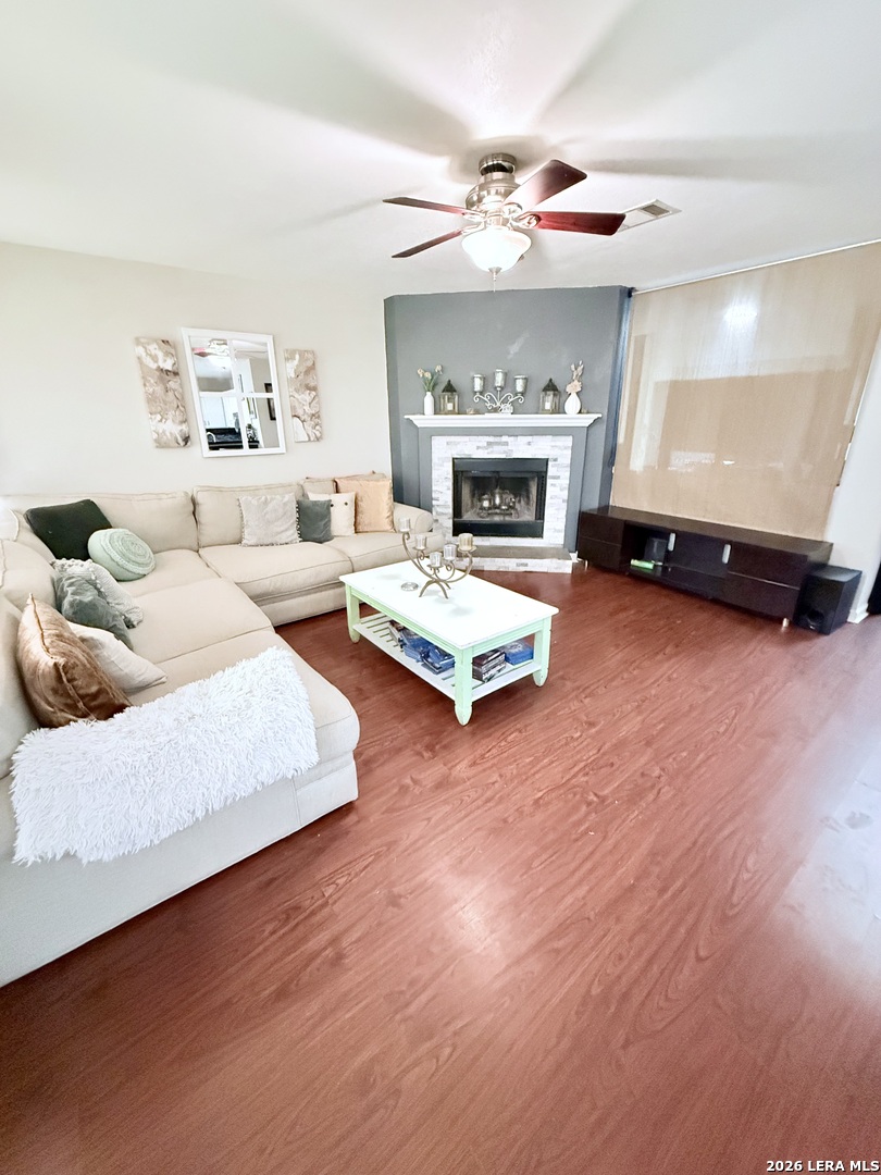 13916 Randalstone Drive Pflugerville, TX 78660 - Photo 7 of 32 a living room with furniture and a fireplace