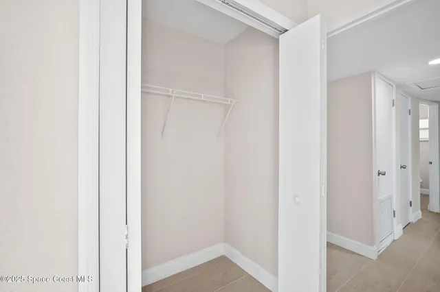 a view of hallway with closet