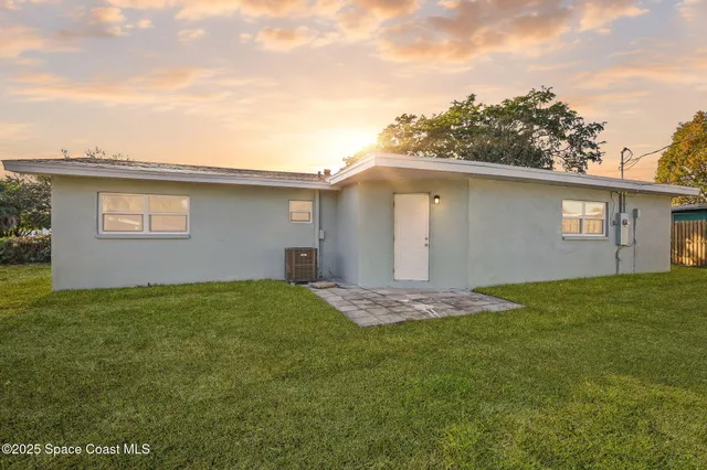 a house view with a backyard space