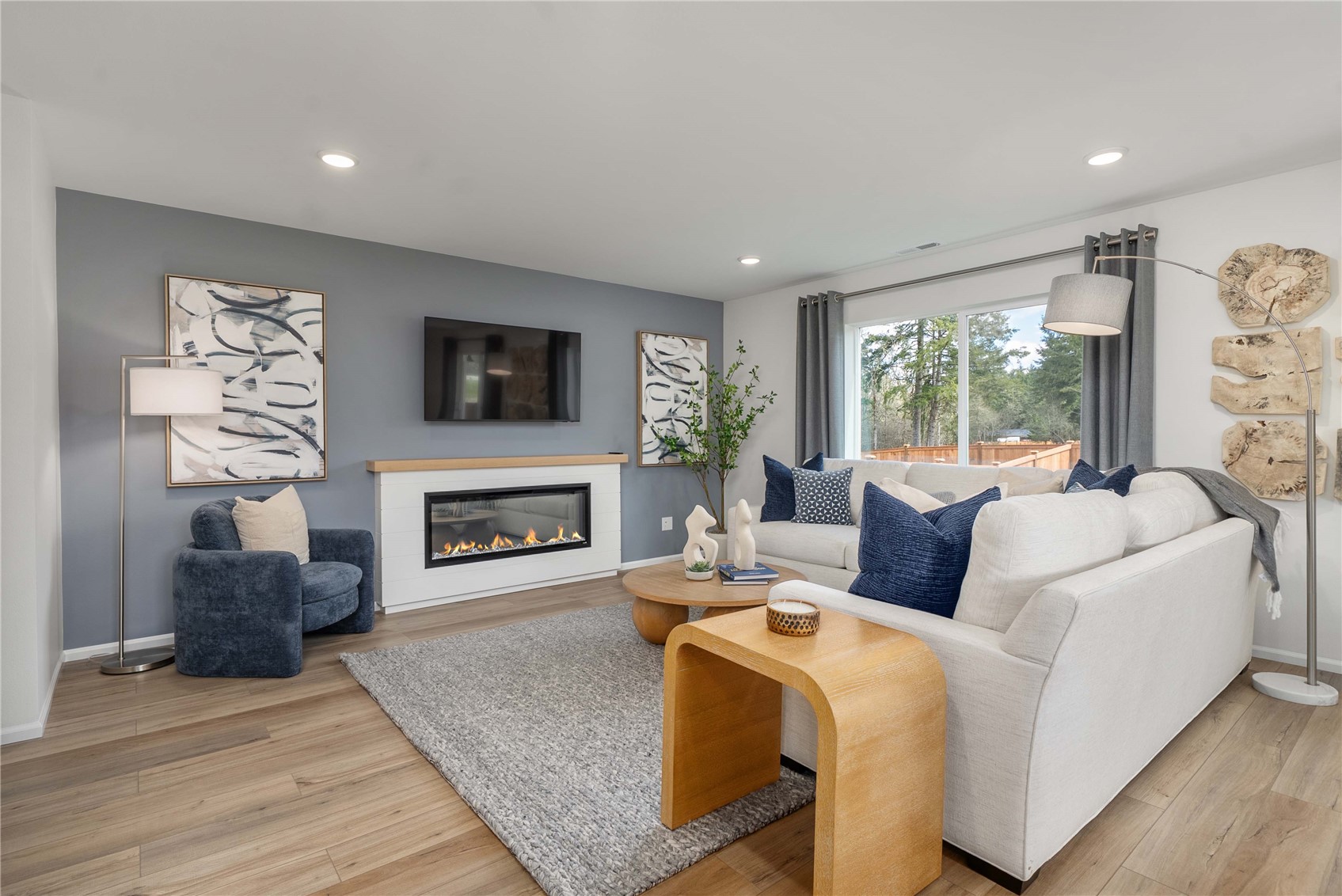 13411 324th Avenue Southeast Sultan, WA 98294 - Photo 5 of 23 a living room with furniture a fireplace and a flat screen tv