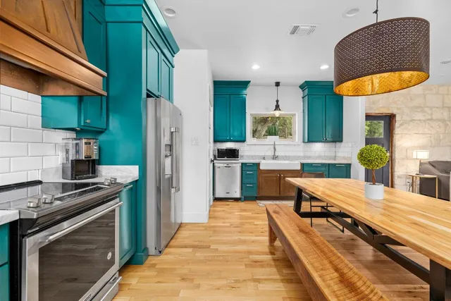 a kitchen with a sink cabinets and window