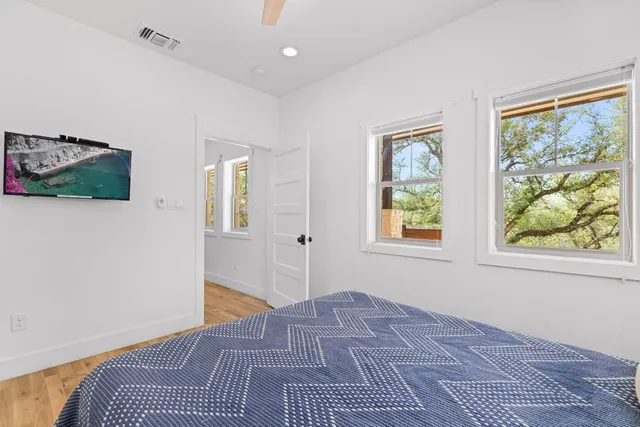 a bathroom with a granite countertop sink a mirror and a vanity