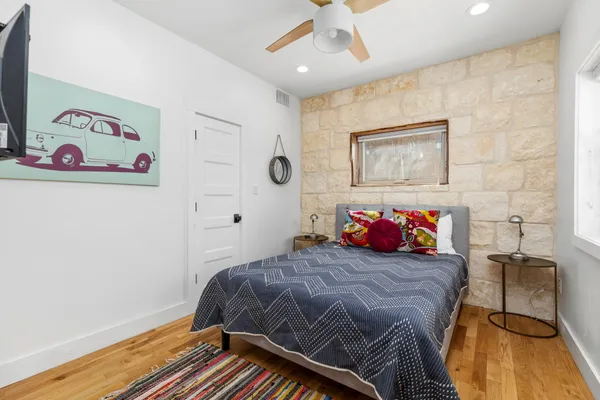 a bedroom with a bed and a dresser