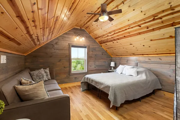 a bedroom with a bed and window