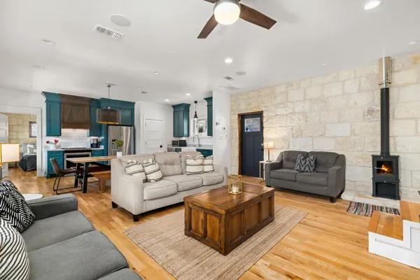 a living room with furniture and a fireplace