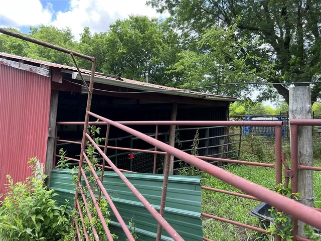 a view of deck with chairs and wooden fence