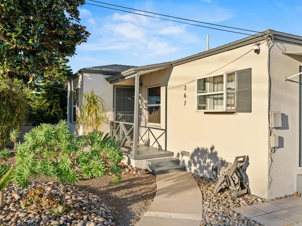 a front view of a house with outdoor space