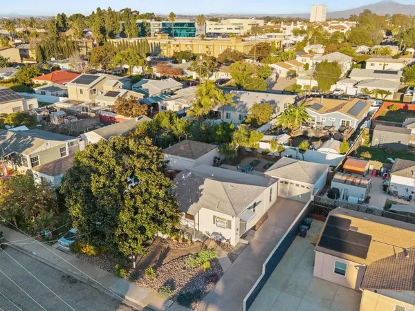an aerial view of residential houses with outdoor space