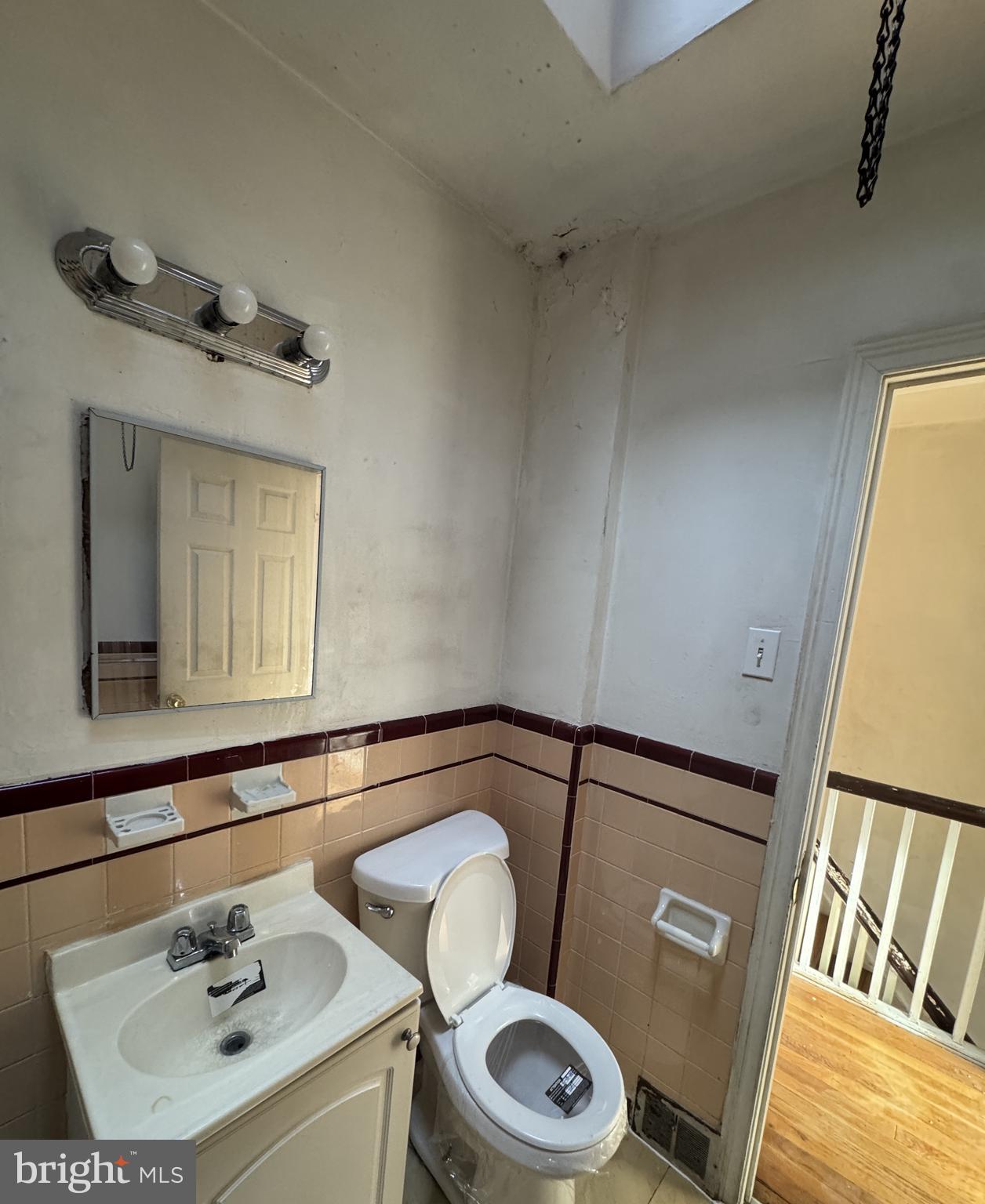 6048 Agusta Street Philadelphia, PA 19149 - Photo 15 of 24 a bathroom with a sink and a mirror