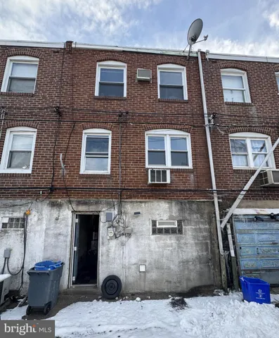 a front view of a building with many windows