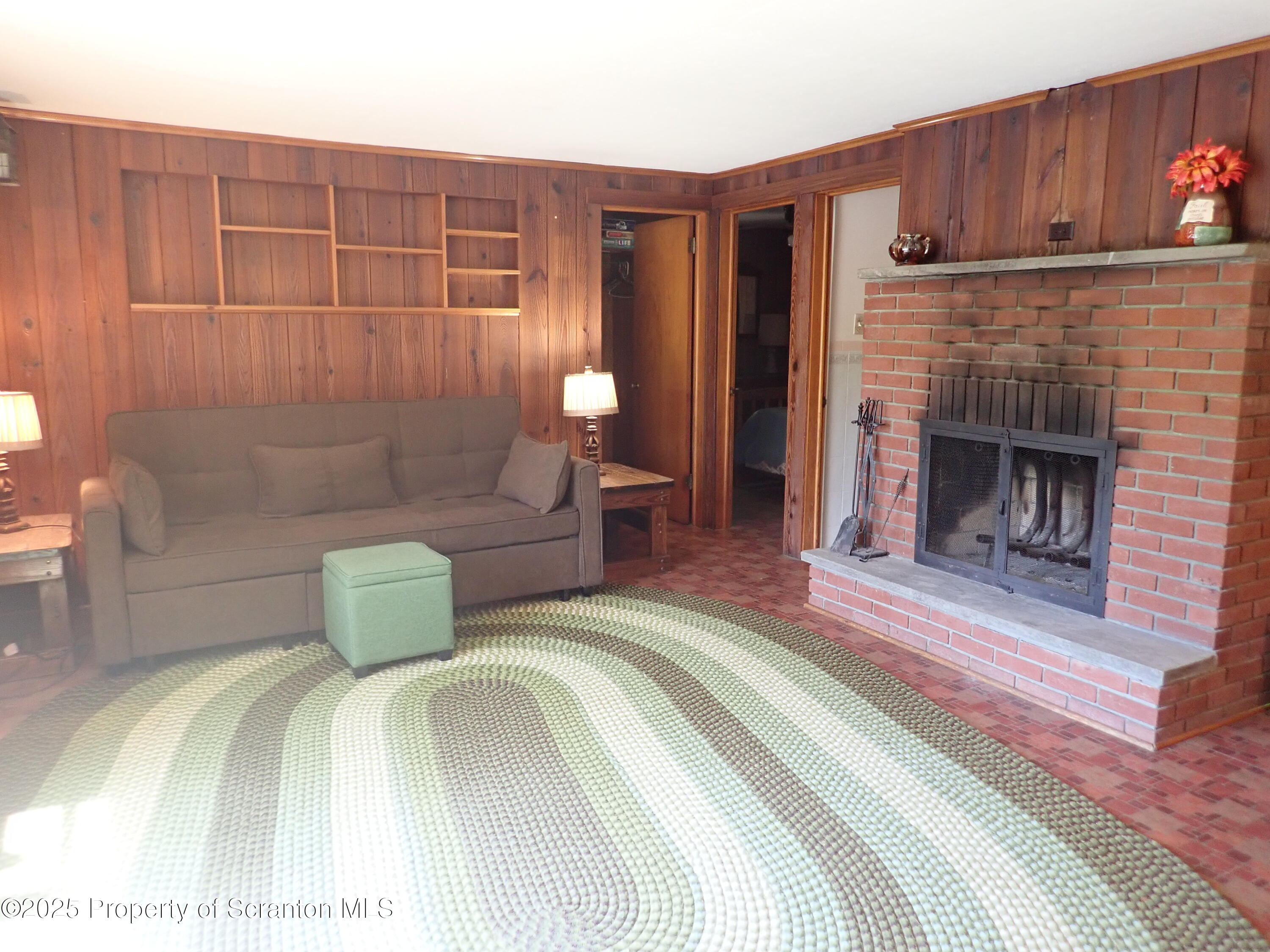 430 Crescent Lake Road Meshoppen, PA 18630 - Photo 15 of 51 a bedroom with a bed and a fireplace