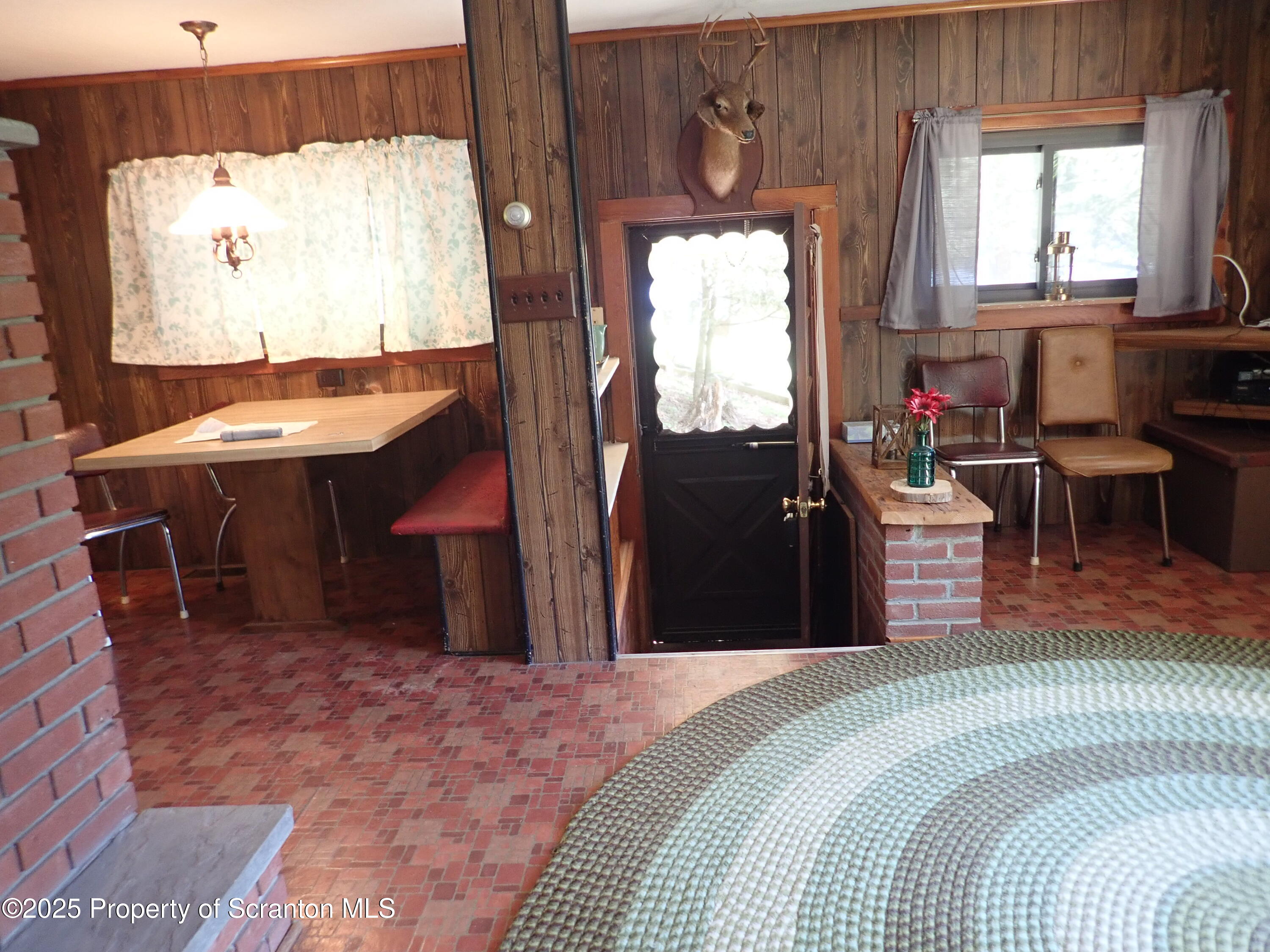 430 Crescent Lake Road Meshoppen, PA 18630 - Photo 17 of 51 a bedroom with a bed and wooden floor
