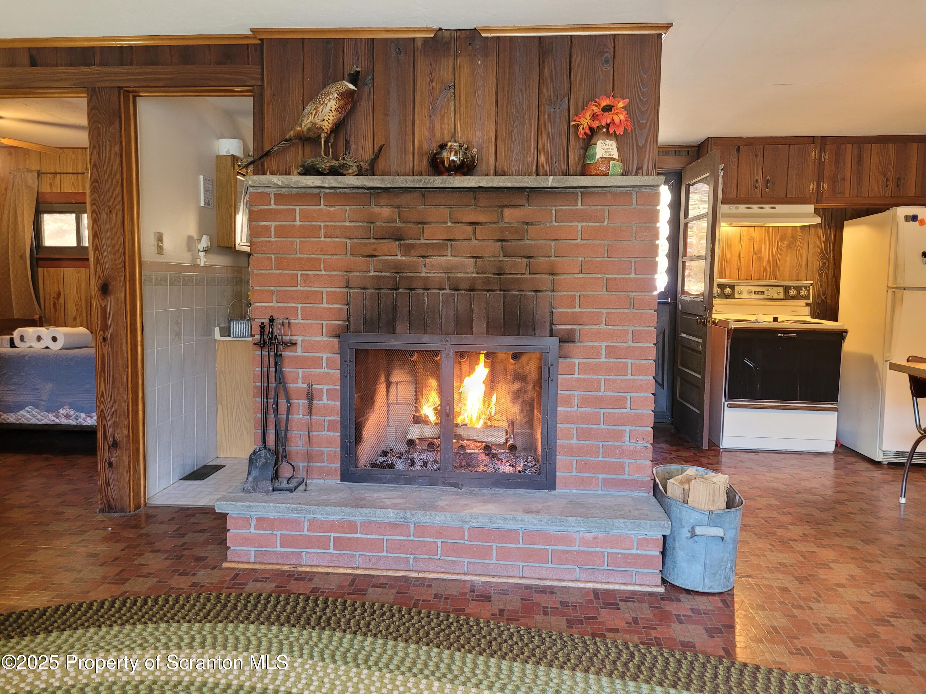 430 Crescent Lake Road Meshoppen, PA 18630 - Photo 19 of 51 a room with furniture and a fireplace