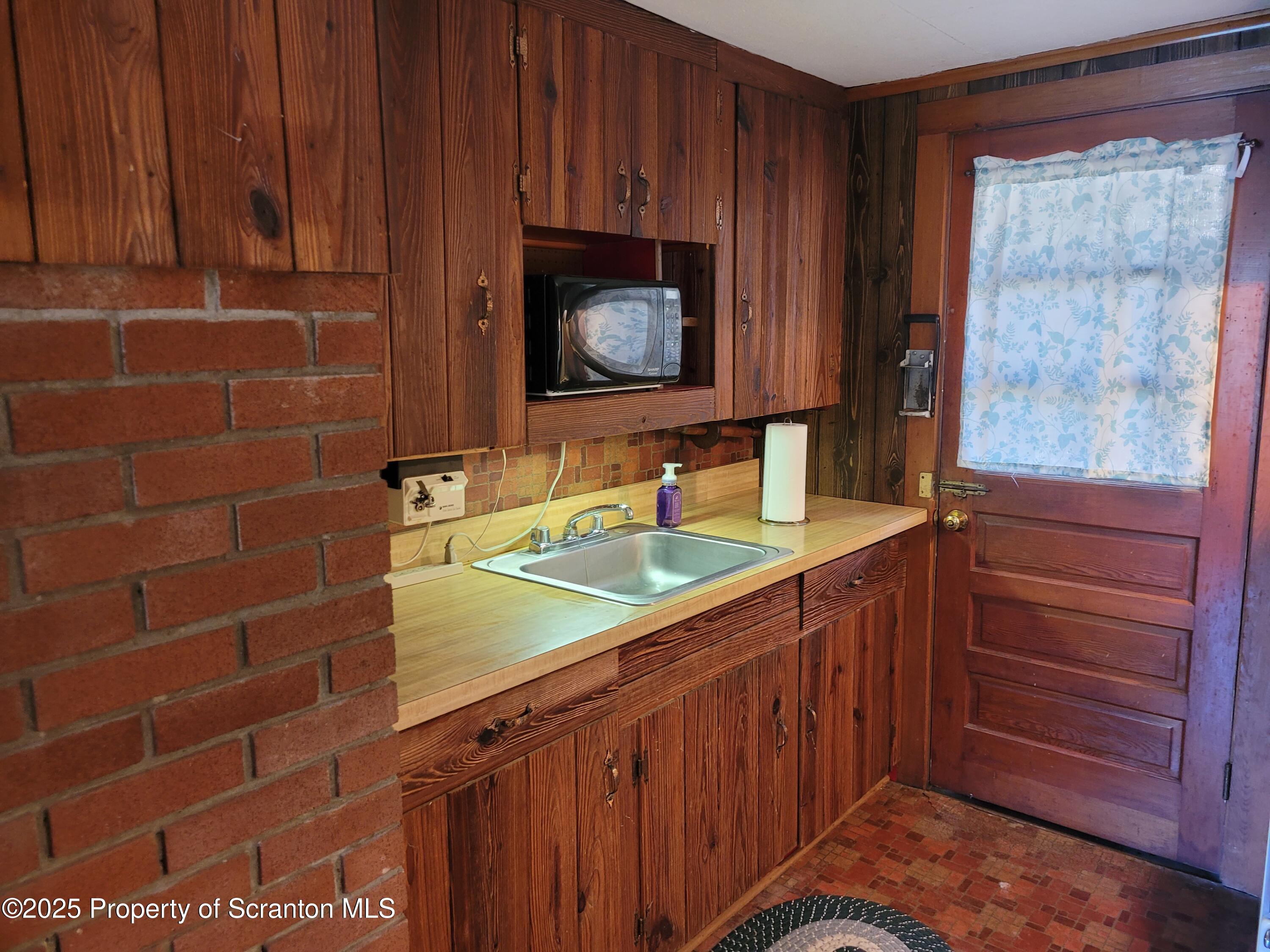 430 Crescent Lake Road Meshoppen, PA 18630 - Photo 22 of 51 a bathroom with a sink and a mirror
