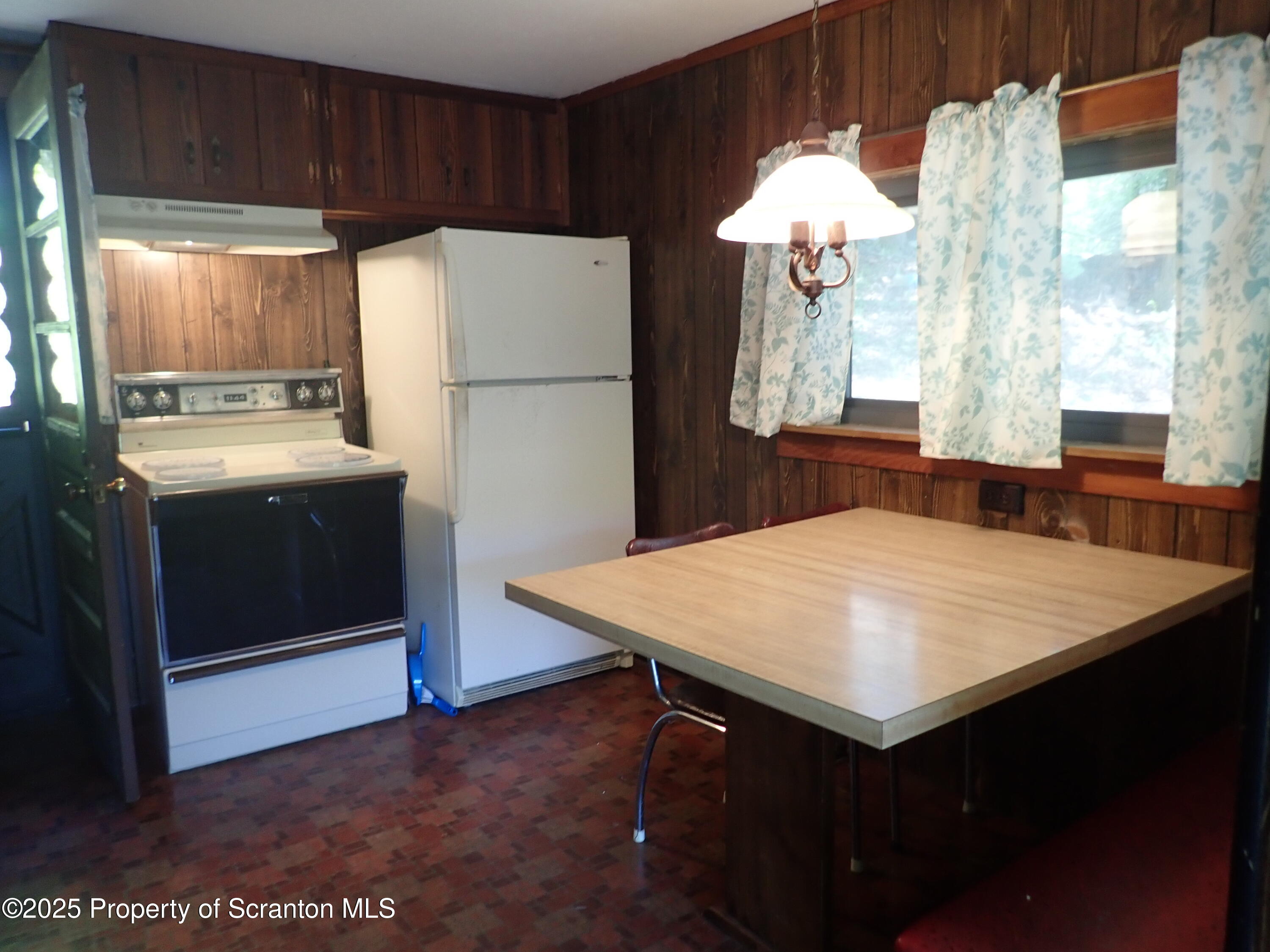 430 Crescent Lake Road Meshoppen, PA 18630 - Photo 24 of 51 a kitchen that has a cabinets and a refrigerator
