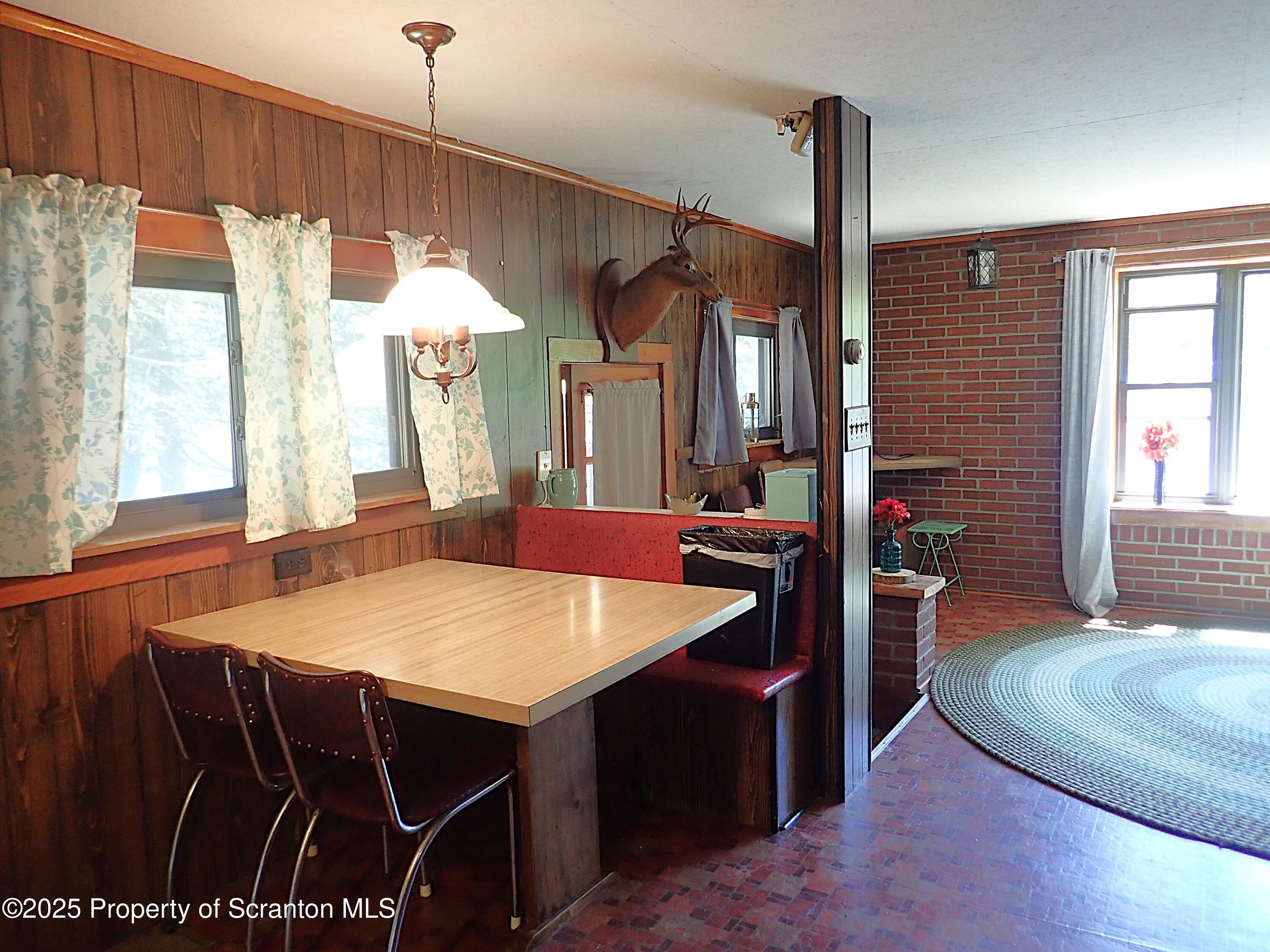 430 Crescent Lake Road Meshoppen, PA 18630 - Photo 25 of 51 a living room with furniture a window and wooden floor