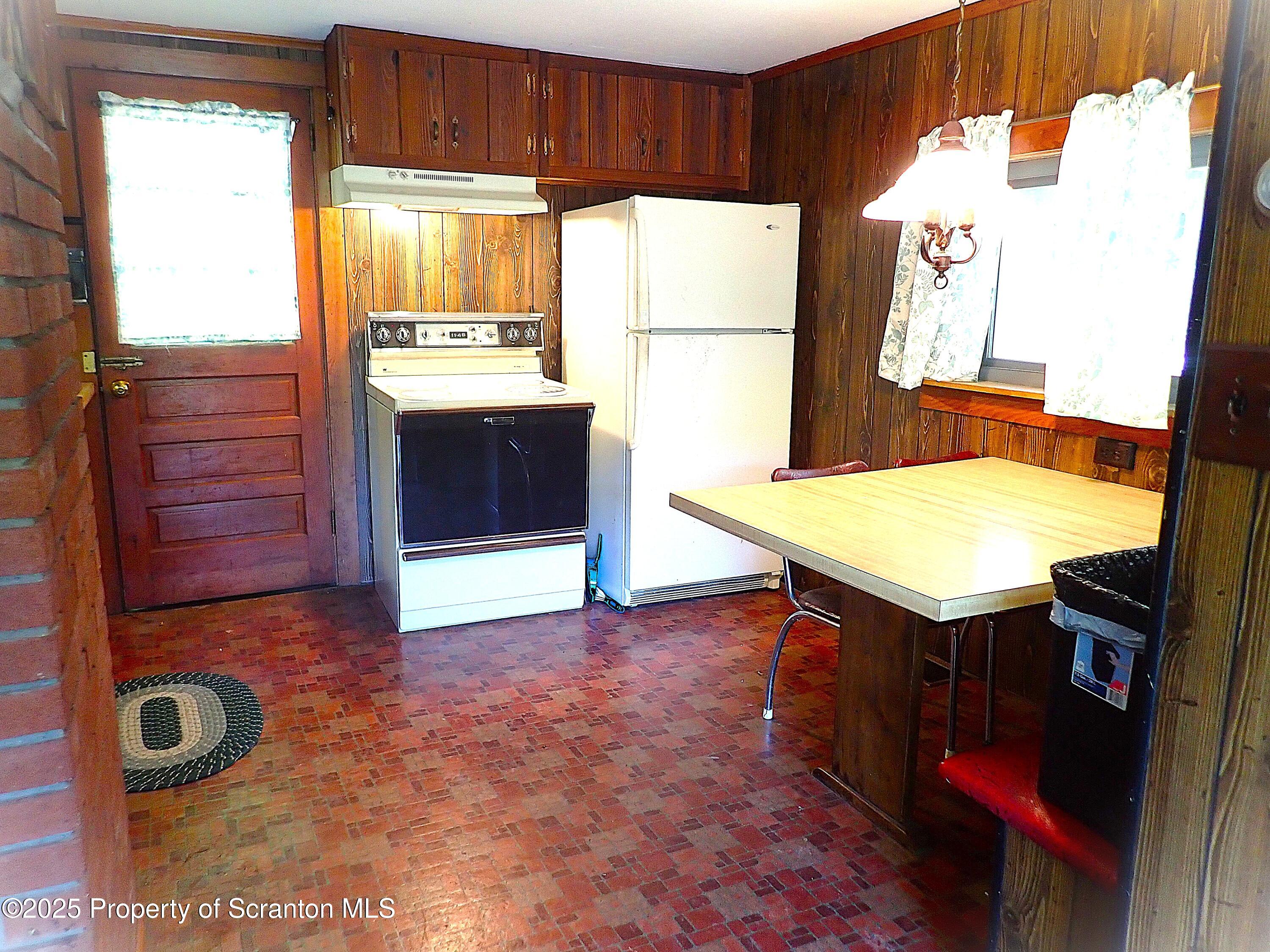 430 Crescent Lake Road Meshoppen, PA 18630 - Photo 26 of 51 a view of kitchen with furniture and window