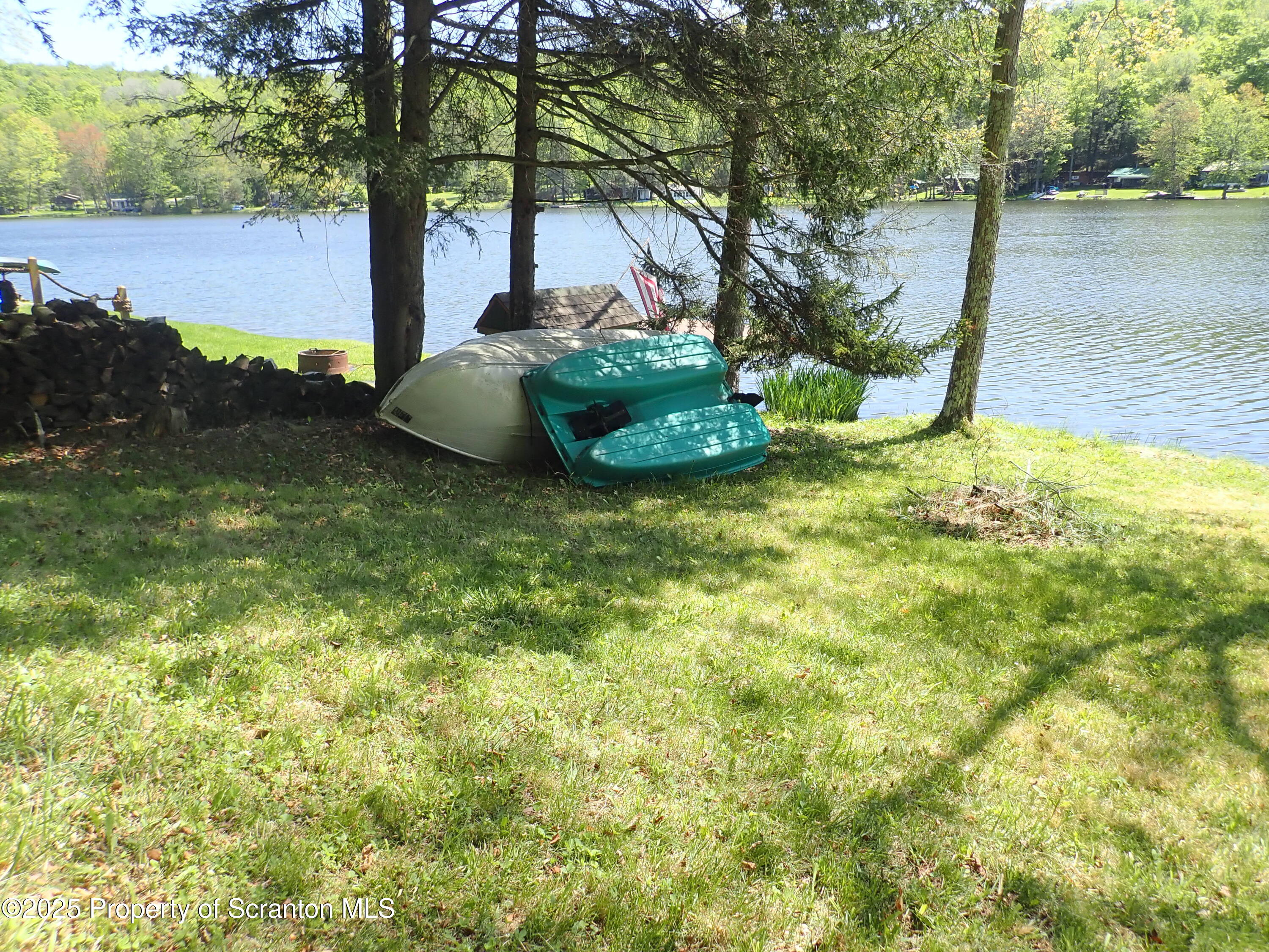 430 Crescent Lake Road Meshoppen, PA 18630 - Photo 33 of 51 a backyard of a house with table and chairs