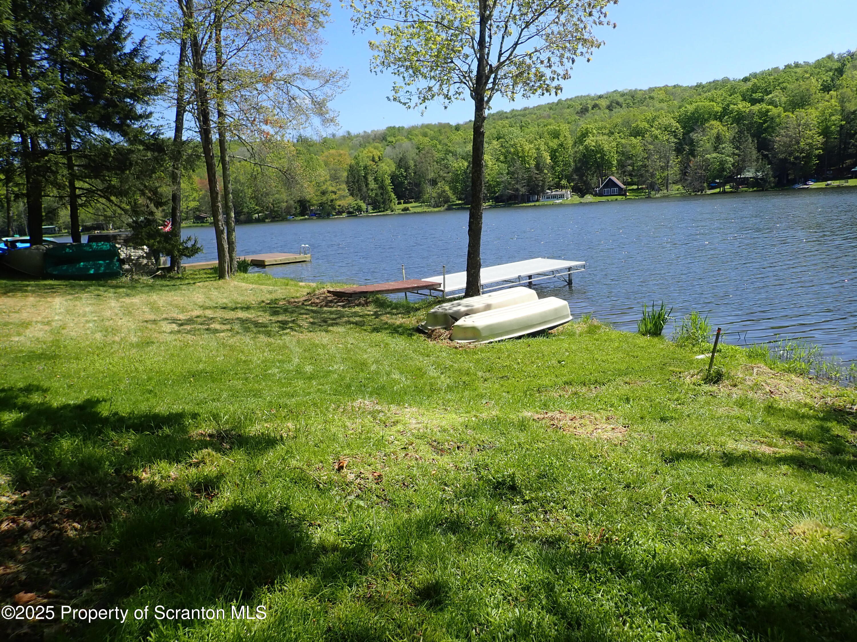 430 Crescent Lake Road Meshoppen, PA 18630 - Photo 34 of 51 a view of a lake with a park