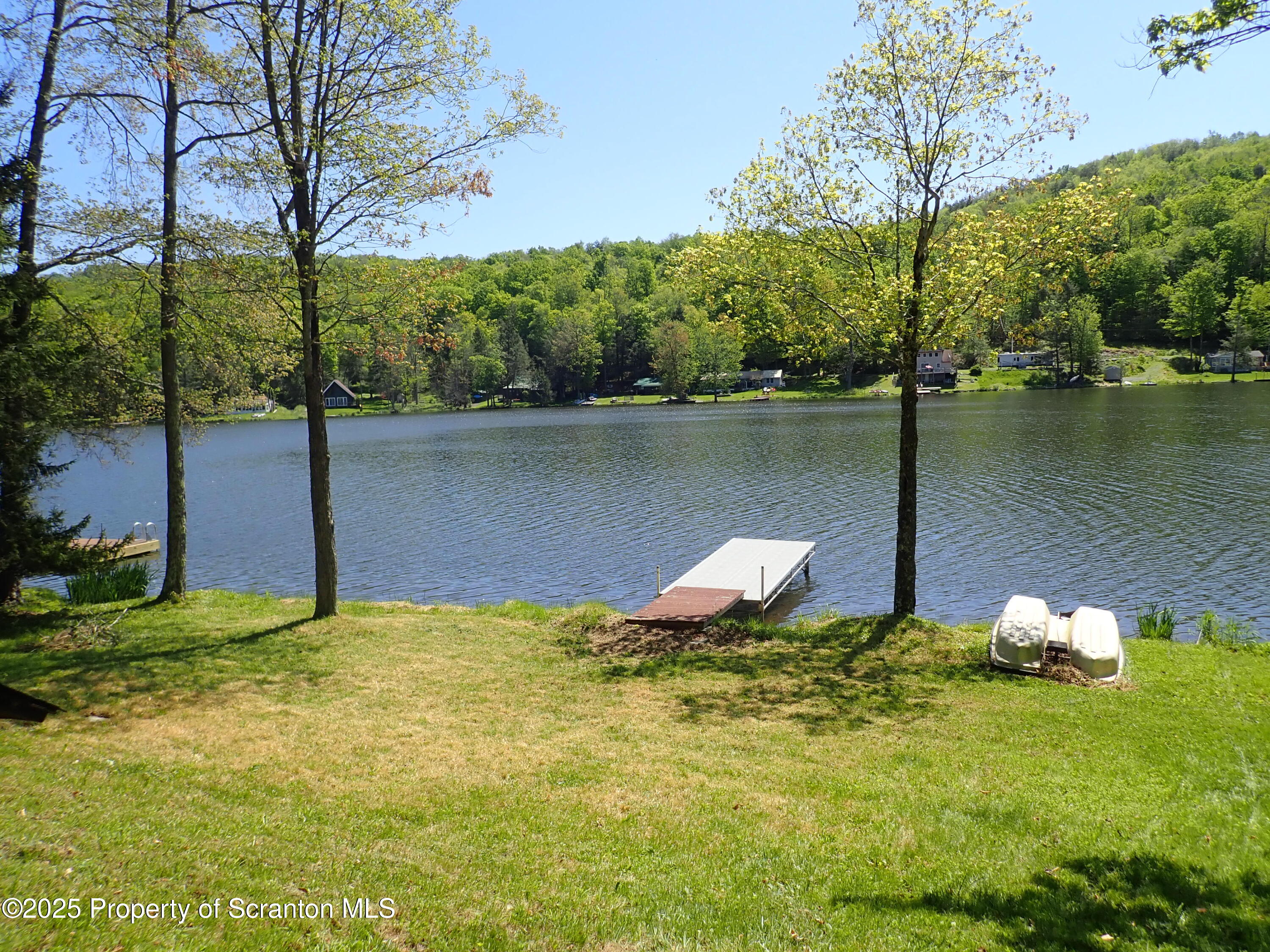 430 Crescent Lake Road Meshoppen, PA 18630 - Photo 35 of 51 a view of a lake from a yard