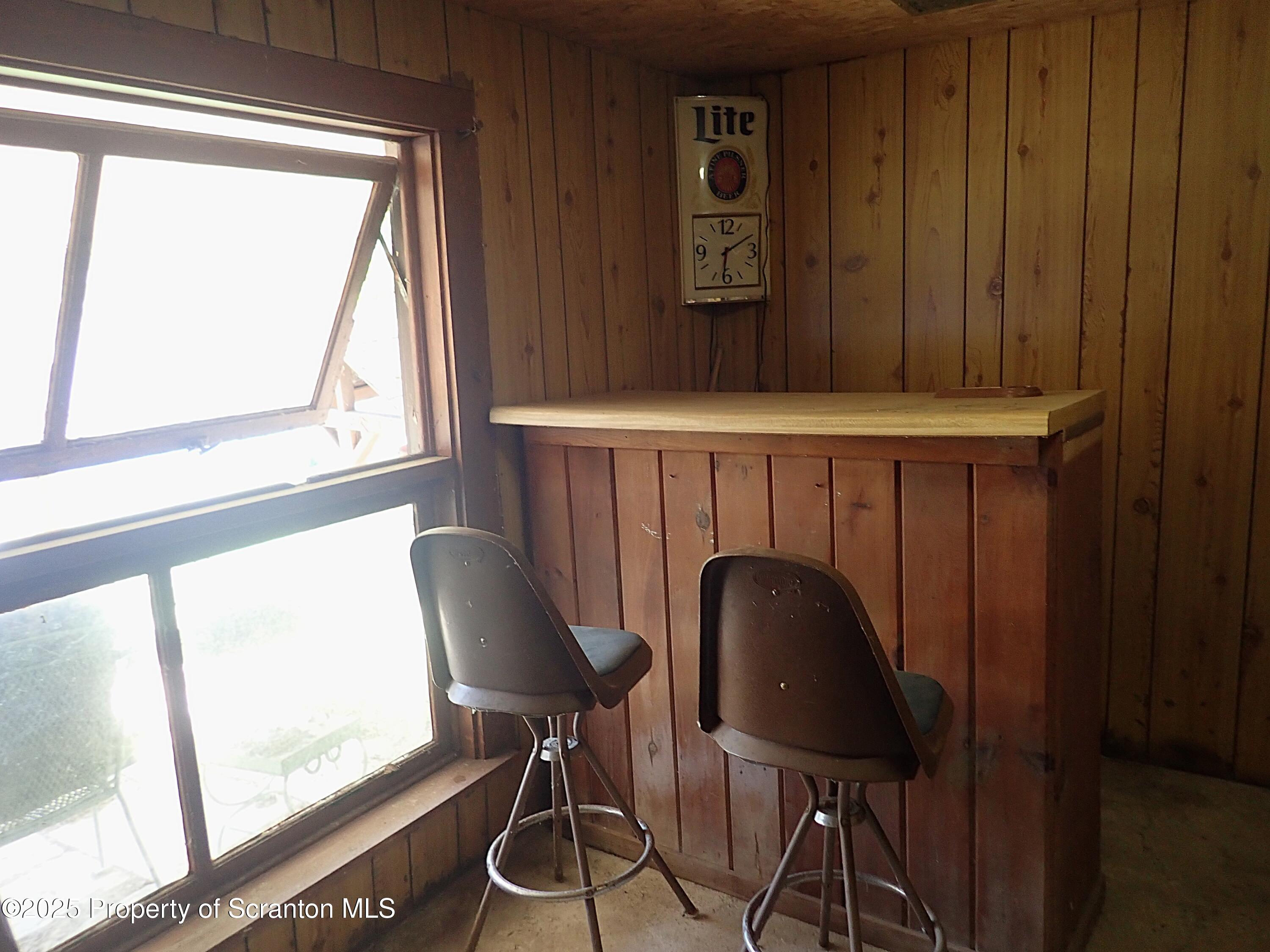 430 Crescent Lake Road Meshoppen, PA 18630 - Photo 44 of 51 a view of a chair and table in a room