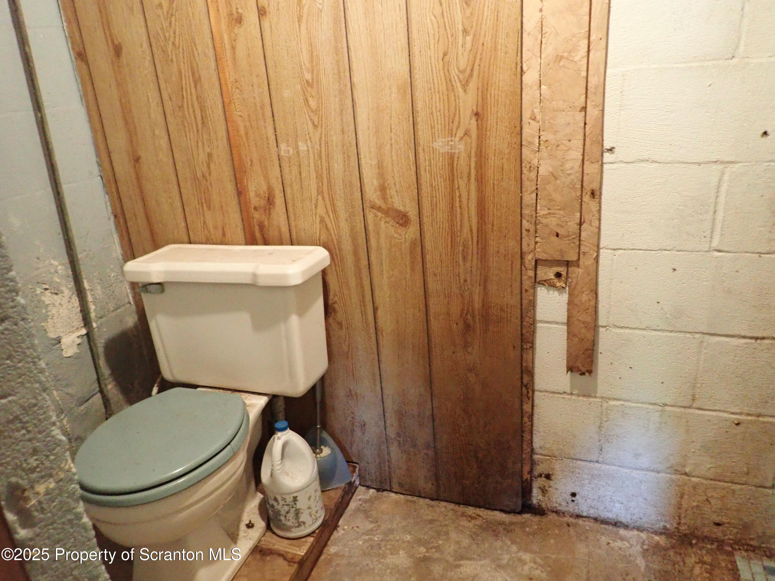 430 Crescent Lake Road Meshoppen, PA 18630 - Photo 47 of 51 a white toilet sitting next to a shower curtain