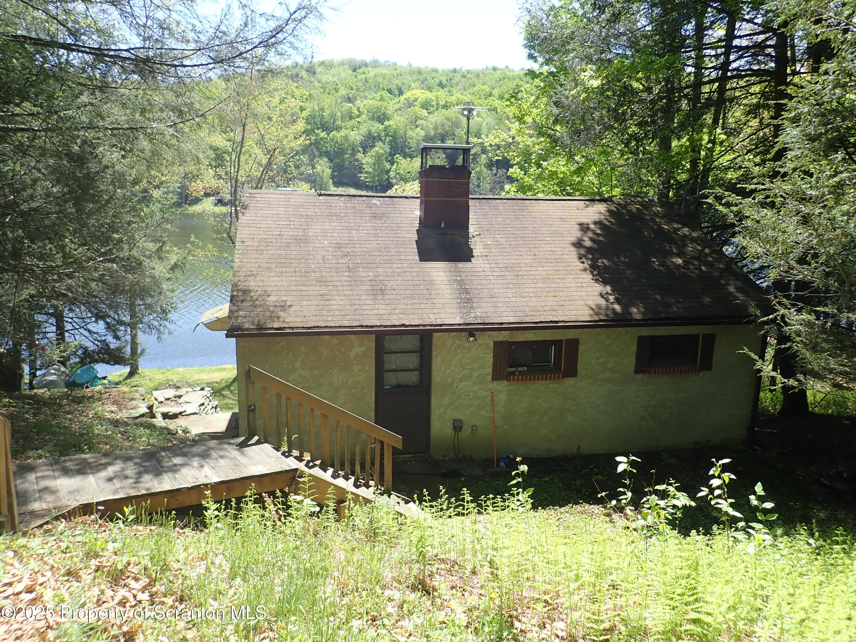 430 Crescent Lake Road Meshoppen, PA 18630 - Photo 8 of 51 a view of house with a swimming pool