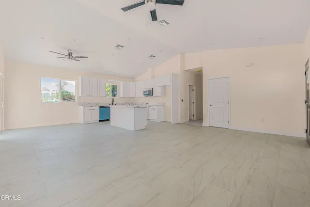 a view of kitchen with cabinets and stainless steel appliances