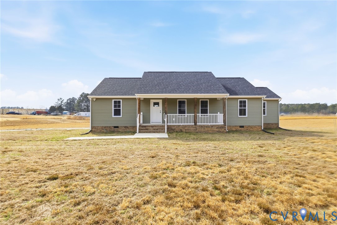 5245 Courtland Road Disputanta, VA 23842 - Photo 1 of 27 a house with lake view