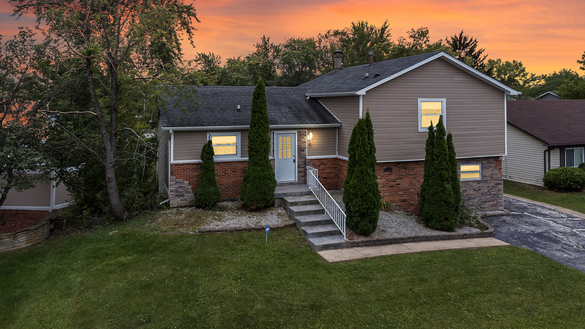 5855 Timberlane Road Matteson, IL 60443 - Photo 1 of 22 a front view of a house with garden