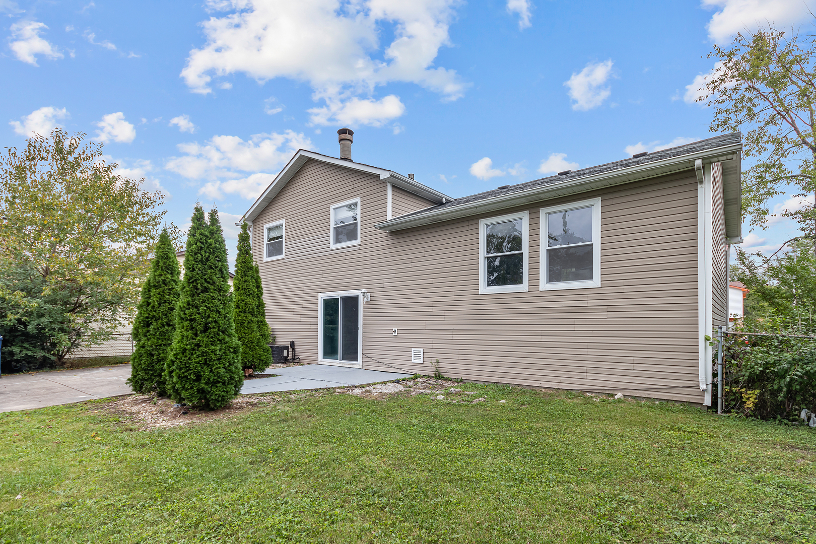 5855 Timberlane Road Matteson, IL 60443 - Photo 18 of 22 a view of a house with a backyard
