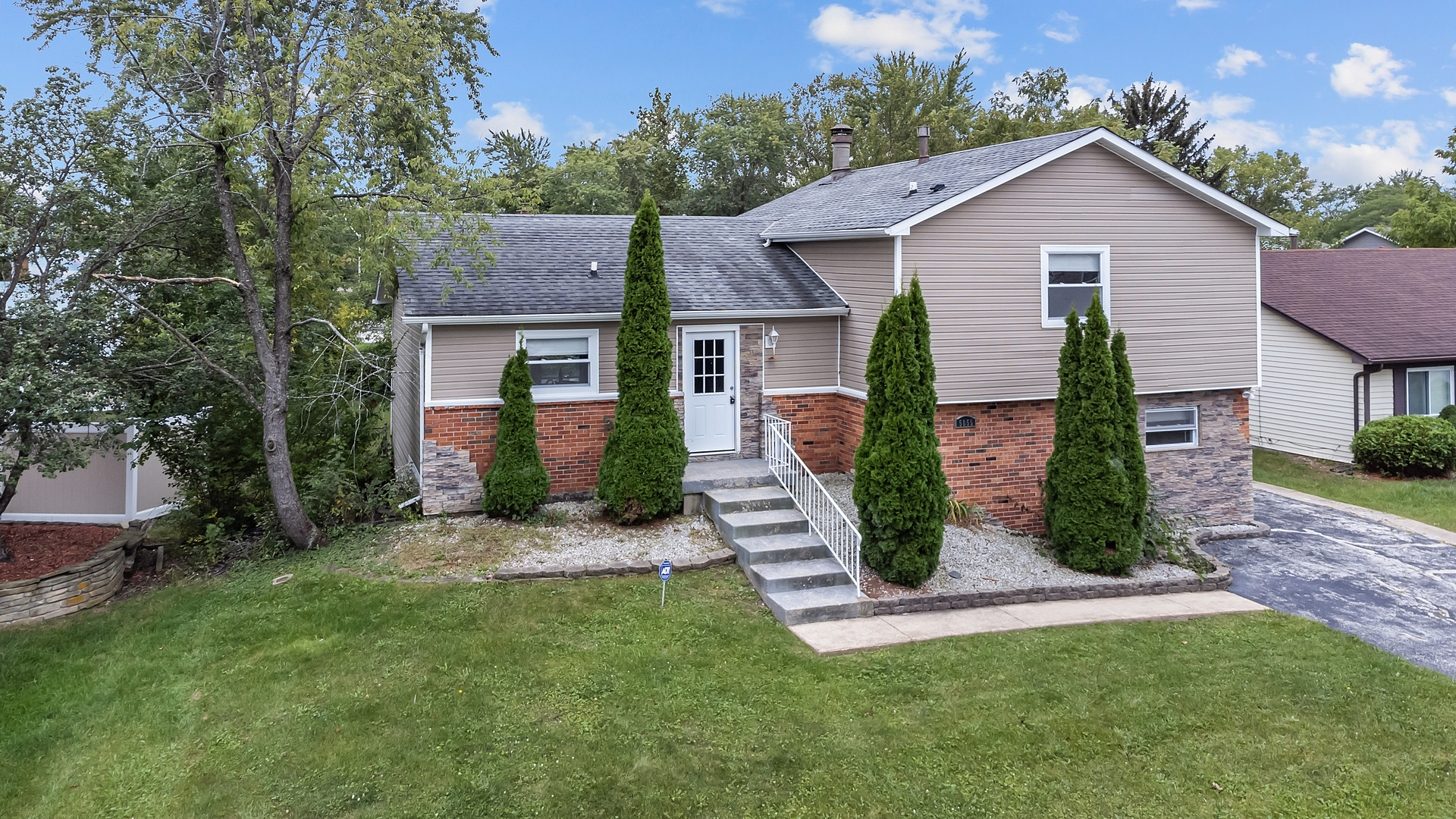 5855 Timberlane Road Matteson, IL 60443 - Photo 2 of 22 front view of a house with a yard