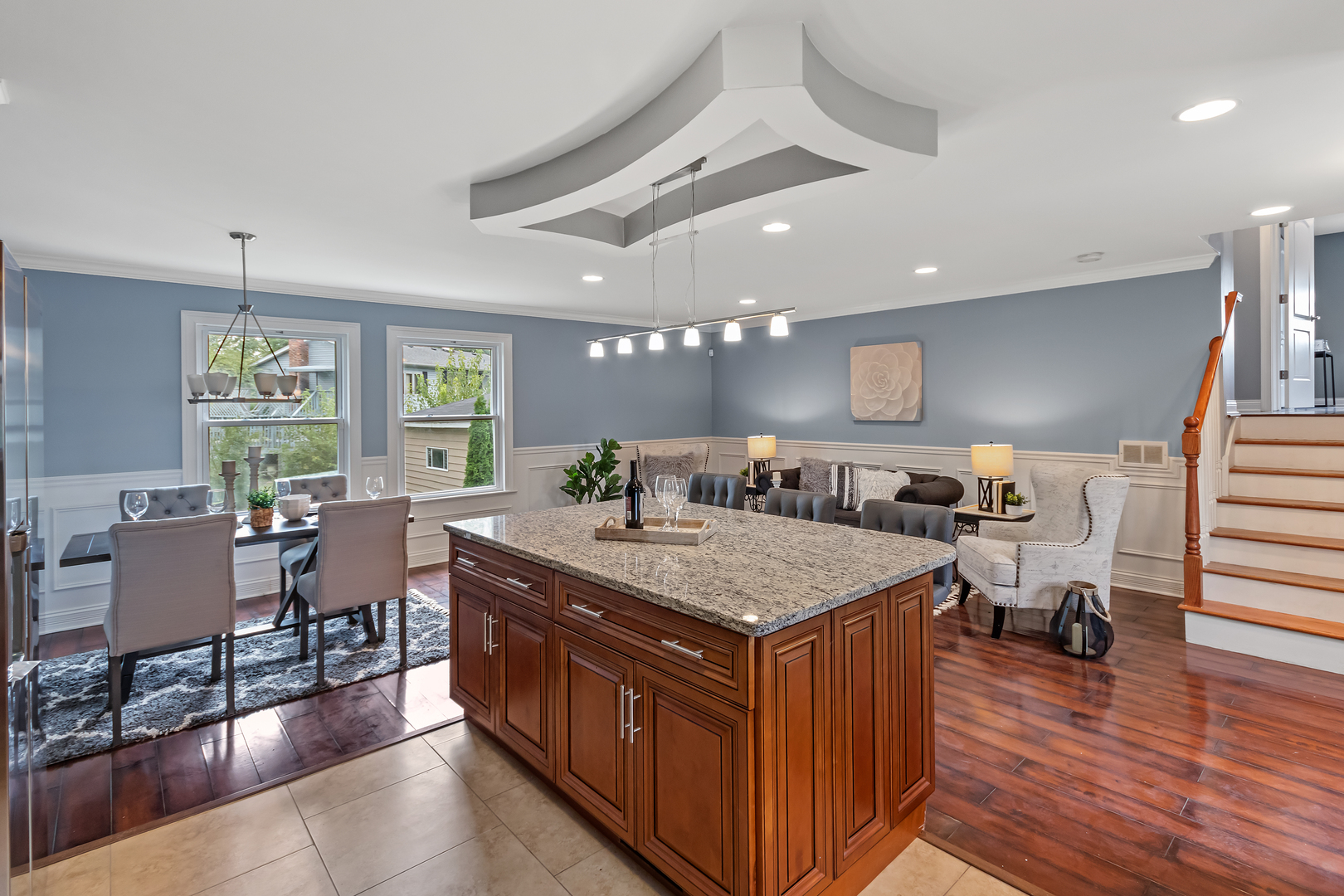 5855 Timberlane Road Matteson, IL 60443 - Photo 5 of 22 a dining hall with stainless steel appliances granite countertop a stove and chairs