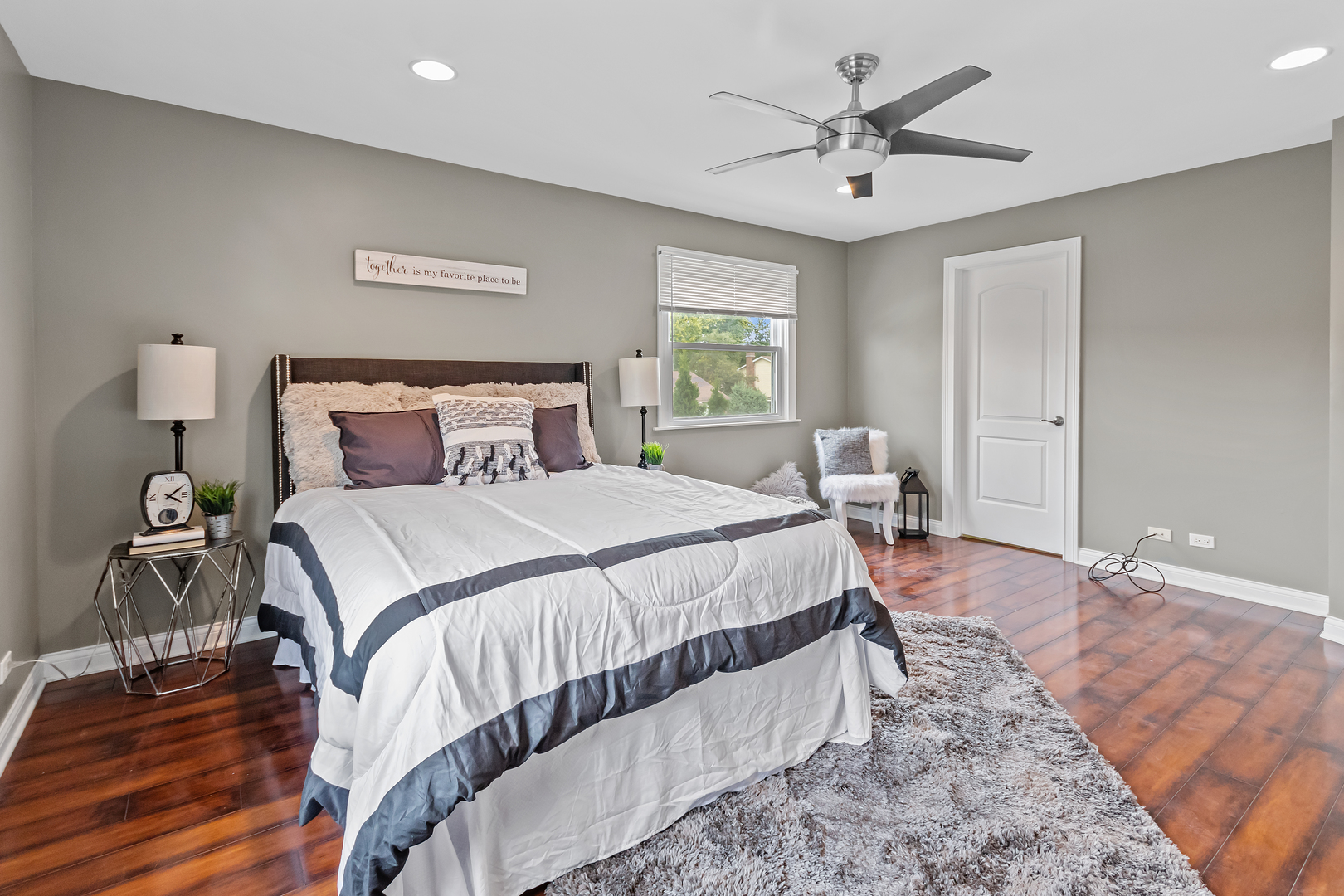 5855 Timberlane Road Matteson, IL 60443 - Photo 8 of 22 a bedroom with bed and a chandelier