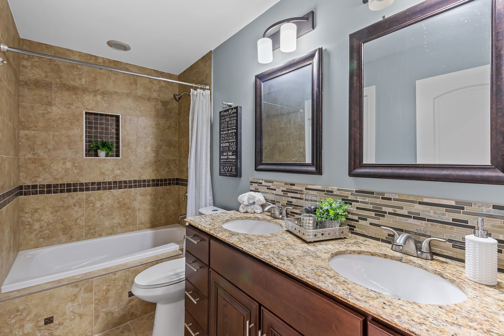 5855 Timberlane Road Matteson, IL 60443 - Photo 9 of 22 a bathroom with a granite countertop tub sink and mirror