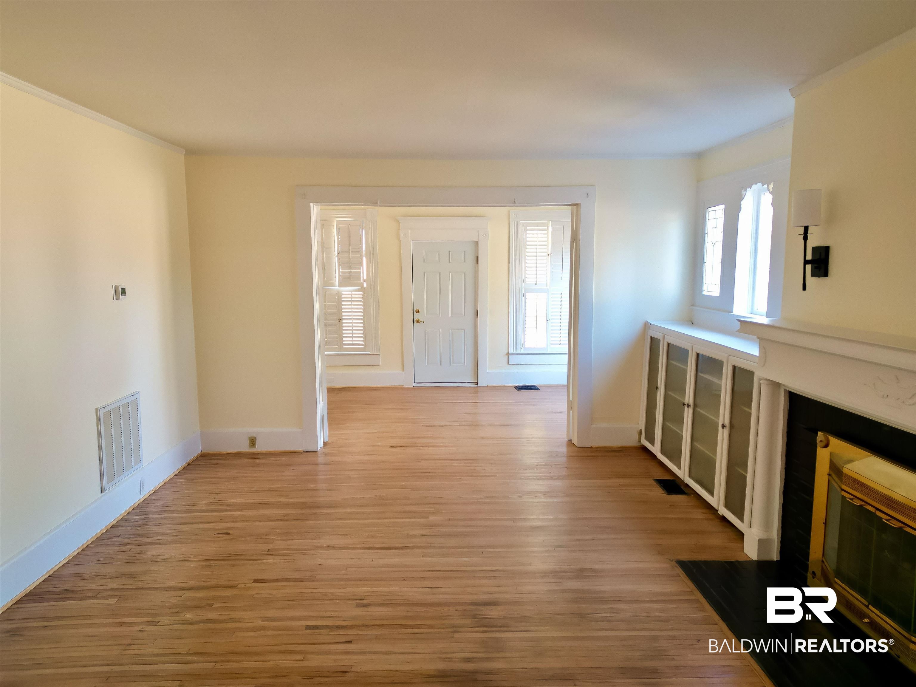 73 Liberty Street Monroeville, AL 36460 - Photo 10 of 29 Unfurnished living room featuring light hardwood / wood-style floors