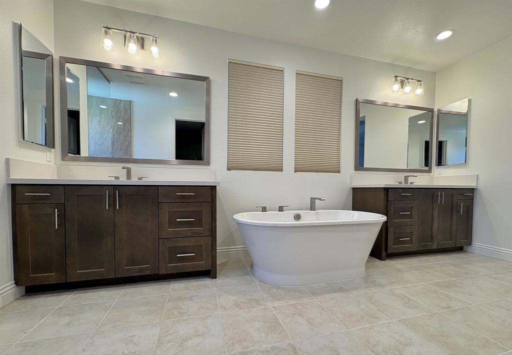 39529 Dayspring Way Temecula, CA 92591 - Photo 27 of 49 a spacious bathroom with a tub sink and mirror
