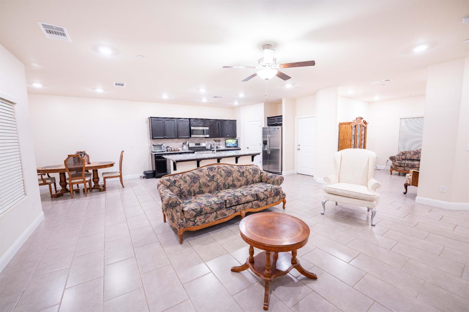 1818 Softwind Drive Tulare, CA 93274 - Photo 16 of 46 a living room with furniture and a wooden floor