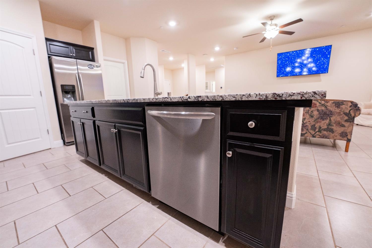 1818 Softwind Drive Tulare, CA 93274 - Photo 20 of 46 a kitchen with stainless steel appliances granite countertop a refrigerator and a stove