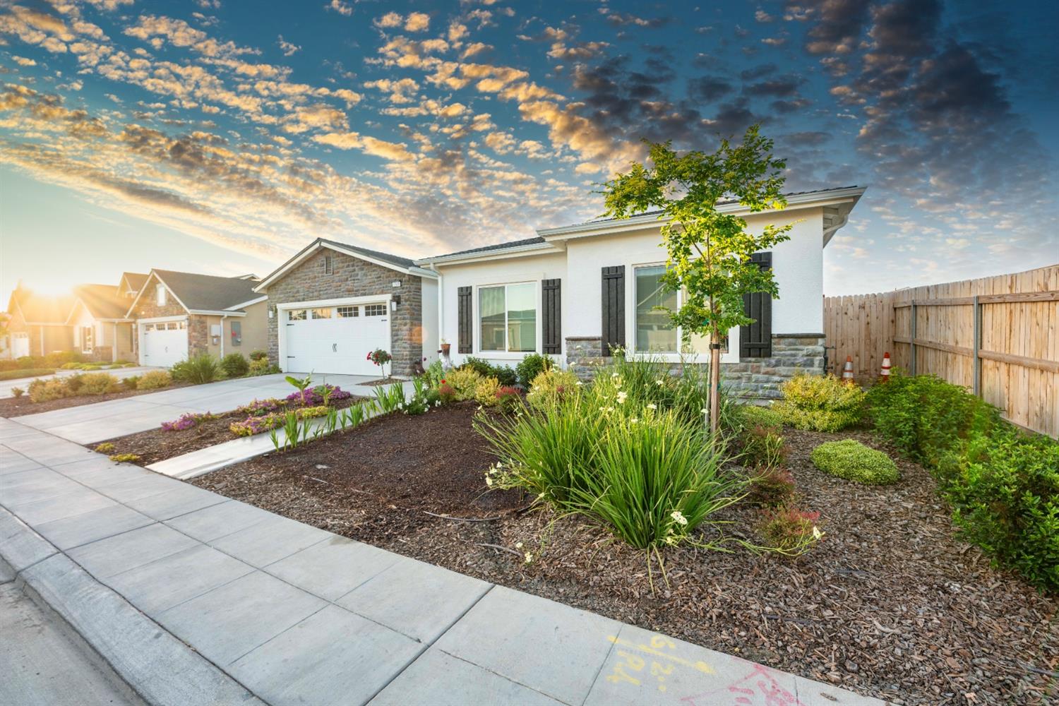 1818 Softwind Drive Tulare, CA 93274 - Photo 4 of 46 a view of a house with a small yard and potted plants