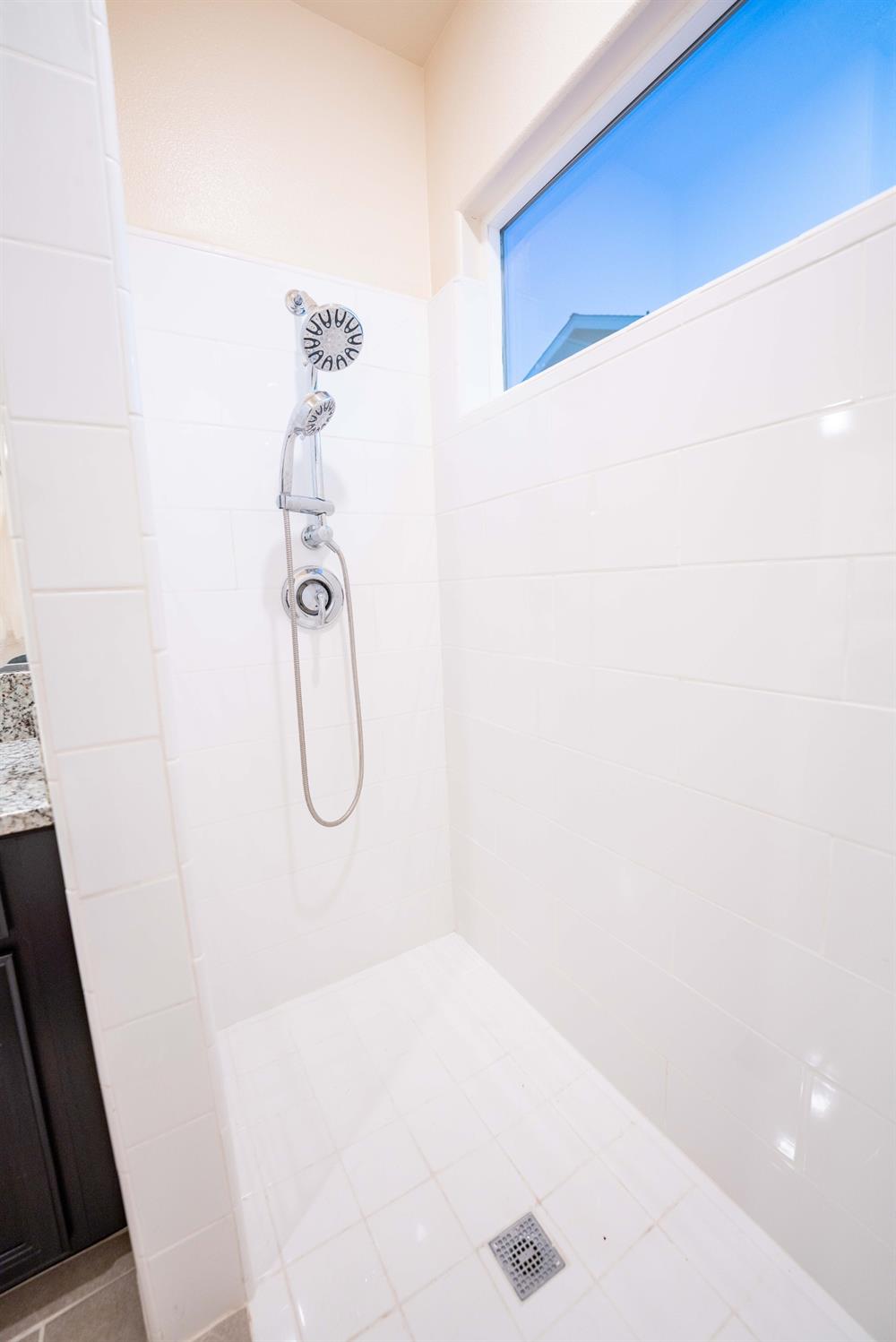 1818 Softwind Drive Tulare, CA 93274 - Photo 32 of 46 a bathroom with a shower