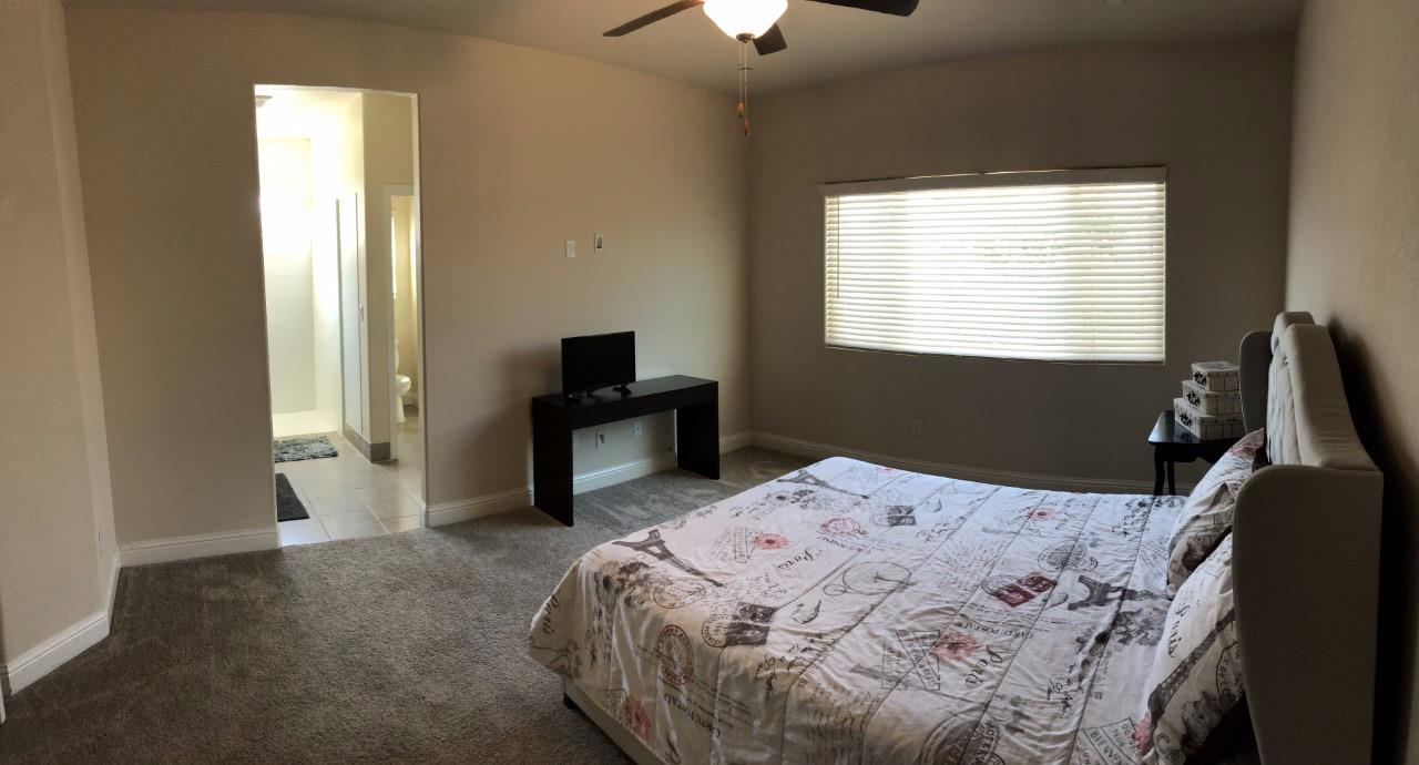 1818 Softwind Drive Tulare, CA 93274 - Photo 41 of 46 a bedroom with a bed and a window