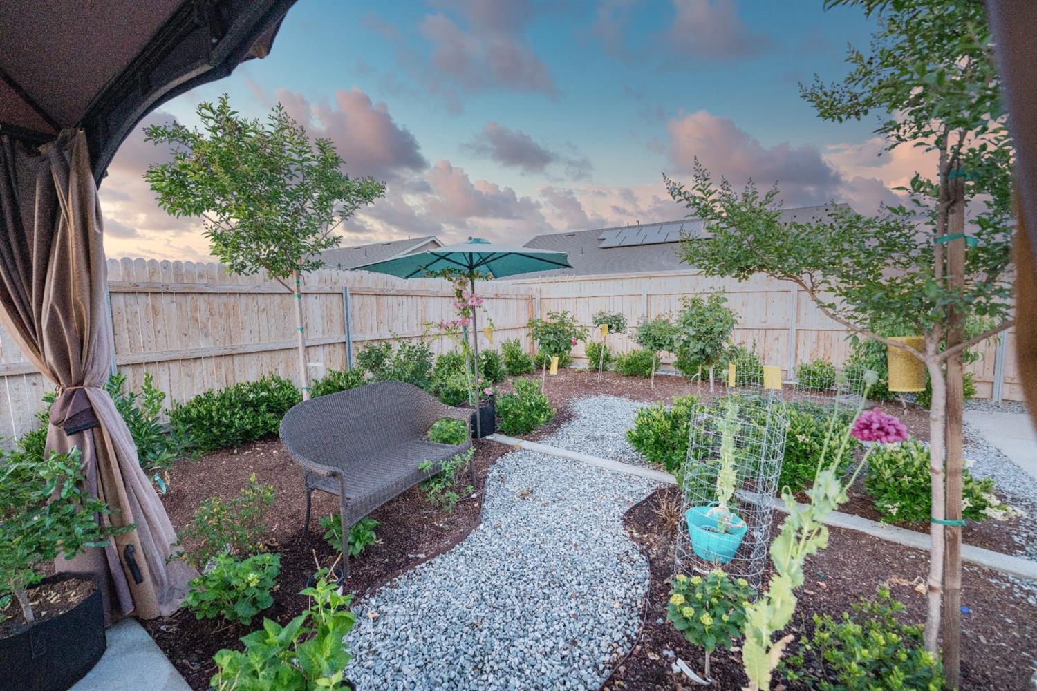 1818 Softwind Drive Tulare, CA 93274 - Photo 45 of 46 a view of a backyard with garden and plants